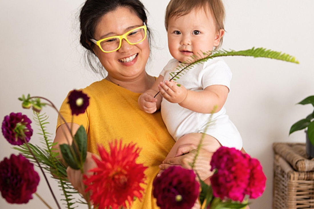 Phil, founder of The Flower Source and former Bloombox Co founder, with baby and fresh flowers